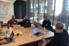 Attendees at a table for contribution day